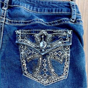 Awesome vintage woman’s jeans with crazy shiny cross embroidery on pockets